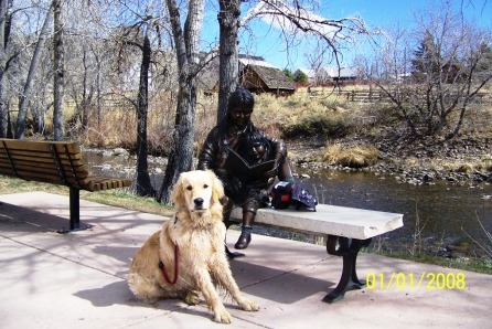 Golden Retriever and Bronze Statue